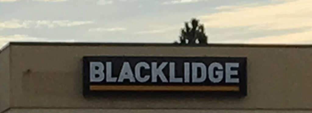 Ron Corder Customs A sign that says blacklide on the side of a building.