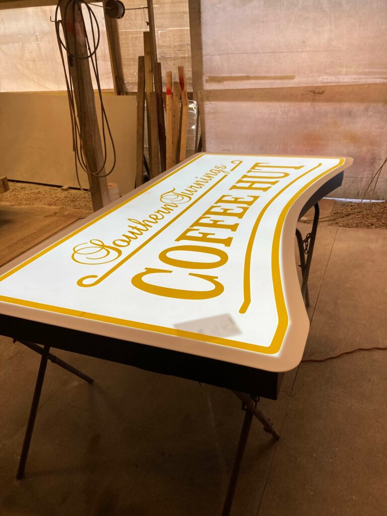 Ron Corder Customs A coffee table with a sign on it.