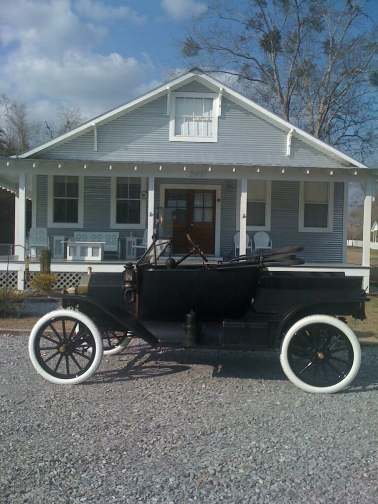 Ron Corder Customs An old car parked Model T in front of a house.