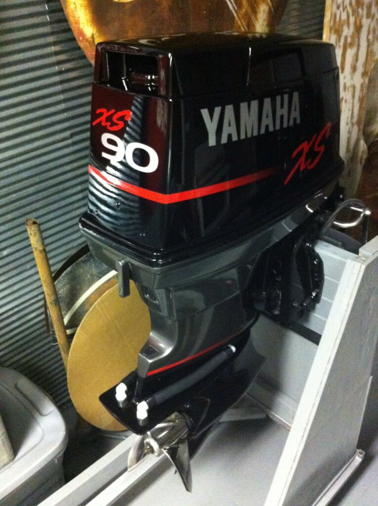 Ron Corder Customs A yamaha outboard motor sitting in a garage.