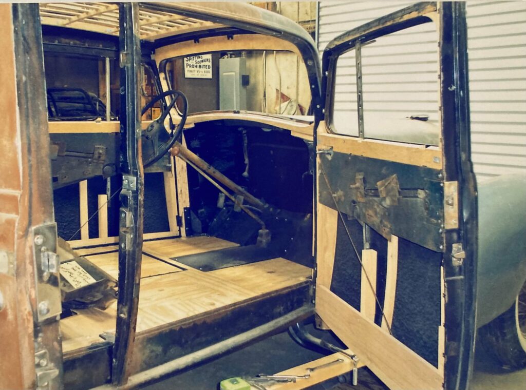 Ron Corder Customs The interior of an old truck is being worked on.