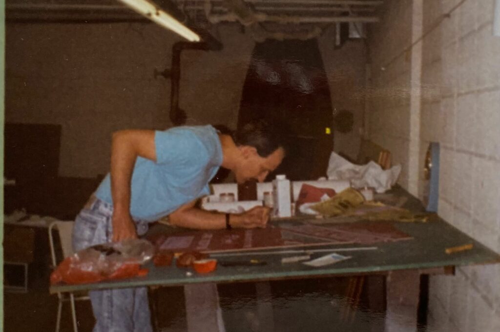 Ron Corder Customs A man working on a table in a garage.